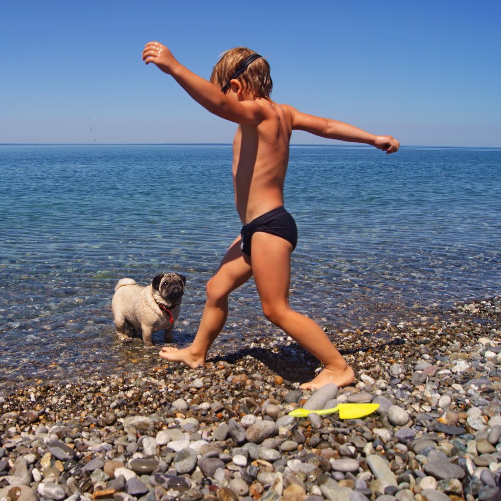 Boy with Pug in Lake cropped